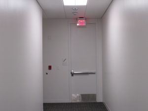 exit door in narrow hallway for emergency evacuation