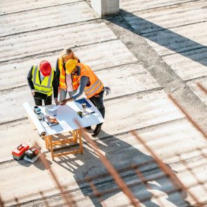 People reviewing an emergency plan on a construction site