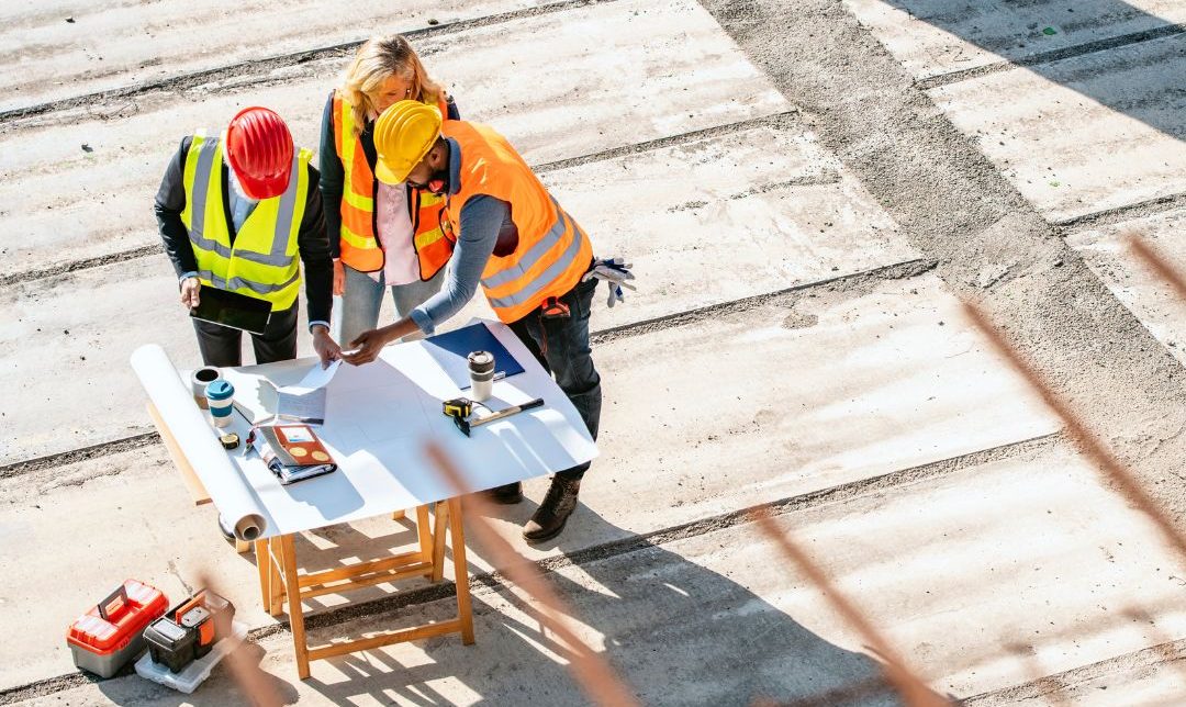People reviewing an emergency plan on a construction site